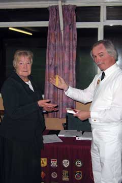 Margaret Barrett receives the Association's Gold Tassel award from the KAA President, Mike Brighton.