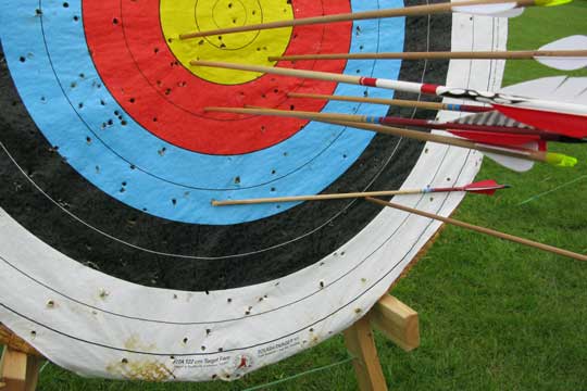 A broken arrow hanging from the target.